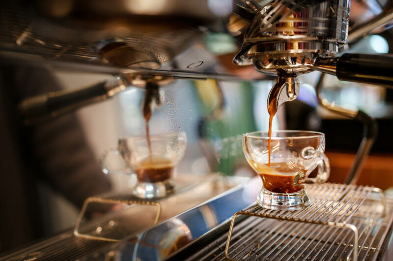 Coffee dripping to cup from Espresso Maker